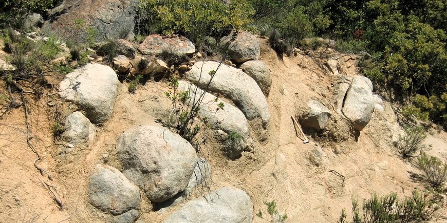Spheroidal weathering in Soils: Jointed bedrock is concentrically dissolved by rock weathering.