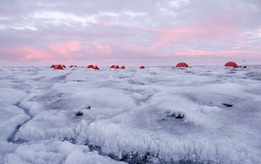 Ice landscape with five red tents