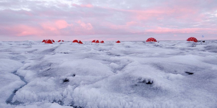 Ice landscape with five red tents