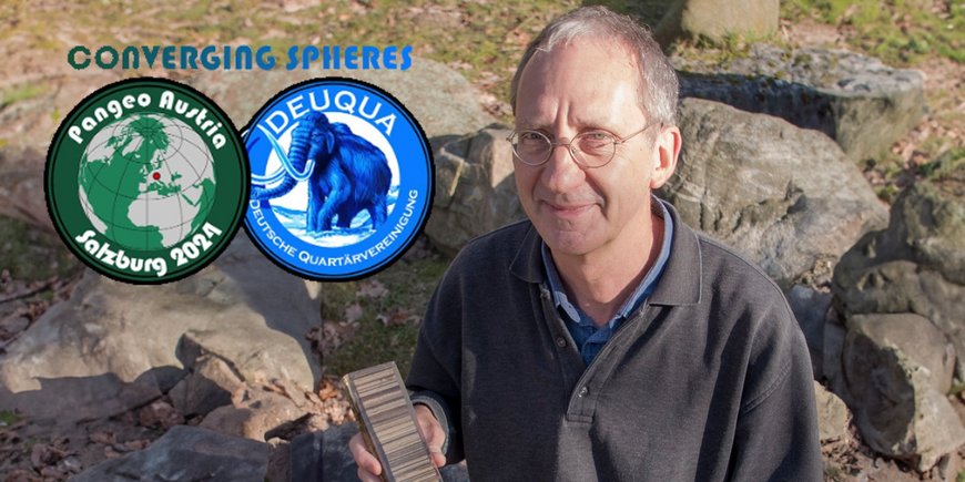 Achim Brauer looks into the camera while holding a prepared sediment core in his hands.